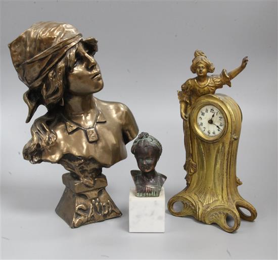 An Art Nouveau gilt spelter timepiece and a small bust on marble base and another